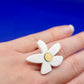 Bague flores blanche farbiquée à Lille 