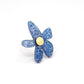 Bague flores en plexiglass bleu pailleté 