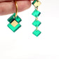 Boucles d’oreilles asymétriques vert miroir saga 