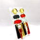 Paire de boucles d’oreilles asymétriques Scandi rouge, noir et doré 
