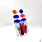 Paire de boucles d’oreilles asymétriques Scandi bleu et orange